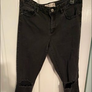 Garage black denim jeans with rips at knees
